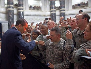 Obama fist-bumps a US soldier at Camp Victory in Baghdad