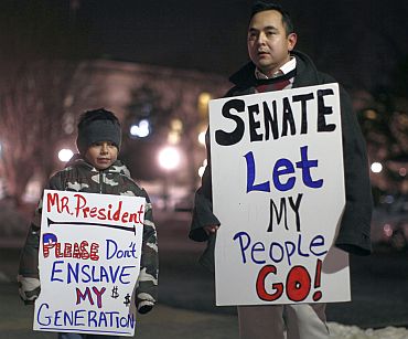 Protestors wait outside the US Capitol as the US Senate prepares to vote on US President Barack Obama's healthcare overhaul