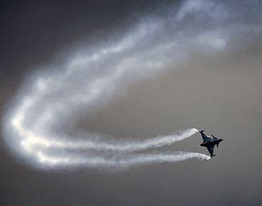 A Saab Gripen lightweight multirole fighter makes a sharp turn during a display