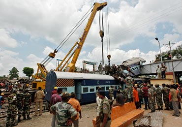 Army personnel help at the mishap site