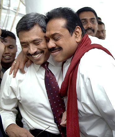 Then Sri Lankan president Mahinda Rajapakse, right, hugs his brother Gotabaya. Photograph: Sudath Silva/Reuters