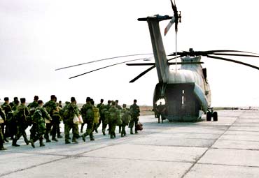 Russian soldiers board a Mi-26 helicopter near Grozny