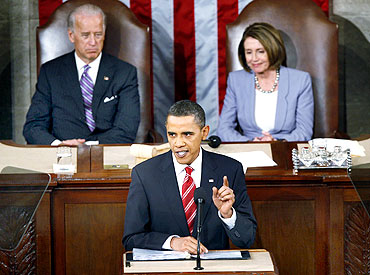 US President Barack Obama with Vice President Joe Biden and House Speaker Nancy Pelosi at the US Capitol in Washington