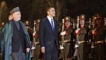 US President Barack Obama inspects a guard of honor with Afghan President Karzai at the Presidential Palace in Kabul on Sunday