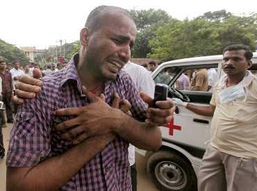 Relatives of the victims of the plane crash mourn after the identification of dead bodies