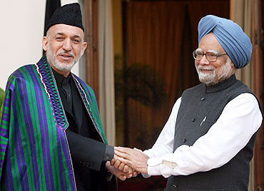 Afghanistan President Hamid Karzai with Prime Minister Manmohan Singh in New Delhi