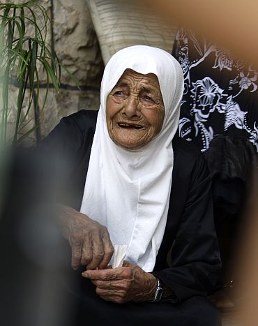 Zahiya Hamoushi, a villager, reacts during clashes between Lebanese and Israeli soldiers at Adaisseh village, southern Lebanon