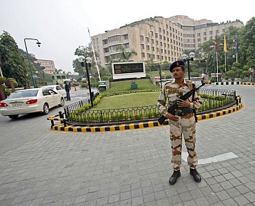 A paramilitary soldier stands guard outside the Hotel Maurya Sheraton in New Delhi