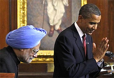 US President Obama greets lawmakers beside PM Dr Singh after delivering a speech at Parliament