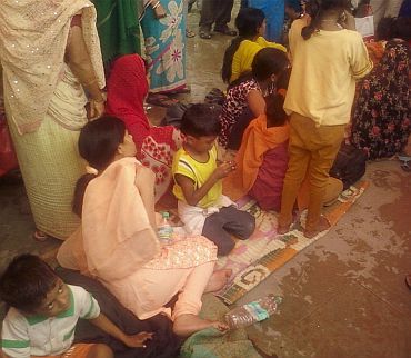 Survivors at the temporary tent accommodation