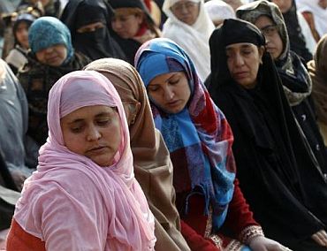 Kashmiri women offer prayers during the Eid al-Adha festival in Srinagar