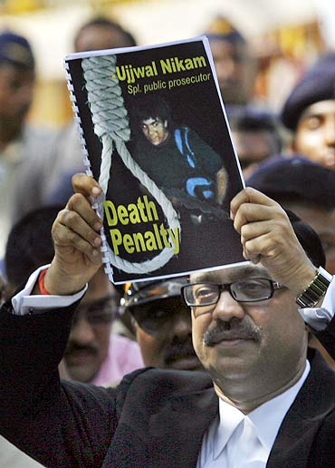 Special Prosecuter Ujjwal Nikam holds up a document at Arthur Road Jail where Kasab's trial was held