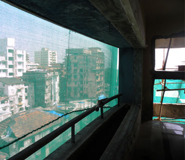 A view of Colaba from an upper floor of Nariman House. A hole ripped from the exterior by grenades