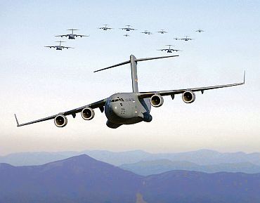 C-17 Globemaster III aircraft fly over the Blue Ridge Mountains in Virginia during low level tactical training