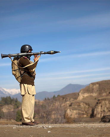 A Pakistani soldier with a rocket launcher on the Afghan-Pakistan border