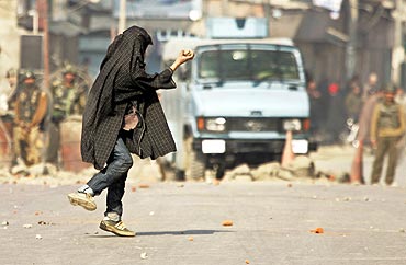 A file photo of Kashmiri stone-thrower in action