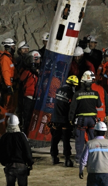 The capsule that will carry the trapped miners to safety is lowered with rescue expert Manuel Gonzalez inside