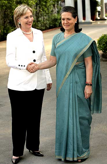 2 powerful female politicians: US Secy of State Hillary Clinton with Congress chief Sonia Gandhi