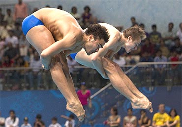 Canada's Alexandre Despatie and Ross Reuben compete during the men's synchronised springboard diving at the Commonwealth Games