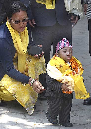 Thapa walks towards a vehicle while leaving for Europe, in Kathmandu