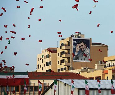 Lebanon's Hezbollah celebrate the visit of Iranian President Mahmoud Ahmadinejad during a rally in the south Lebanese town of Bint Jbeil