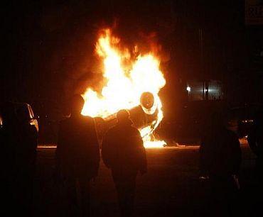 A car burns during a violent overnight protests against the opening of a new waste dump in Terzigno