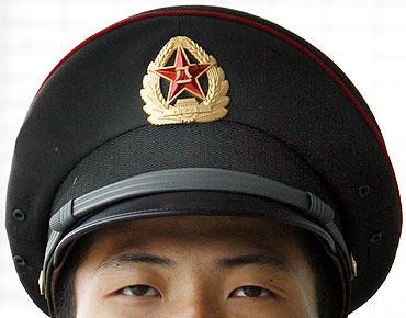 A People's Liberation Army soldier keeps watch at a military camp in Beijing