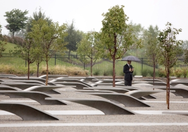 A man stands at the September 11th memorial at the Pentagon