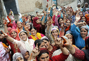 Kashmiris shout slogans during a protest in Srinagar