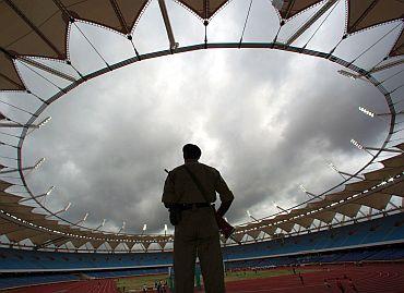 A policeman guards a CWG stadium in Delhi. The CWG panel is facing corruption charges worth crores