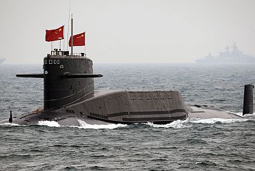 A Chinese Navy nuclear submarine takes part in an international fleet review