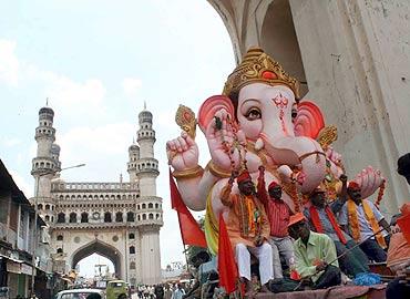 Massive Ganesh immersion processions pass near the Charminar in Old Hyderabad on Wednesday