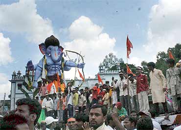 Massive Ganesh immersion processions pass near the Charminar in Old Hyderabad on Wednesday