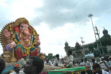 Massive Ganesh immersion processions pass near the Charminar in Old Hyderabad on Wednesday