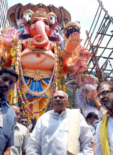 Andhra Pradesh Chief Minister K Rosaiah leaves a Ganesh mandap after offering prayers on Wednesday