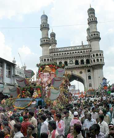 Massive Ganesh immersion processions pass near the Charminar in Old Hyderabad on Wednesday