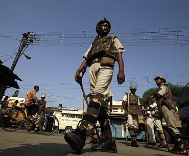 Policemen patrolling a road in Ayodhya on September 23