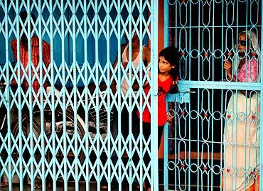 A family in their house after curfew was clamped on a few areas in Ratlam, September 4