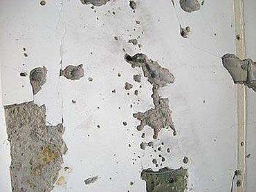 Bullet holes on one of the walls of Chabad House