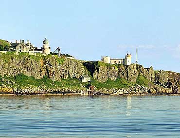Little Cumbrae island has a few buildings, a castle in ruins, a mansion, a lighthouse and cottages