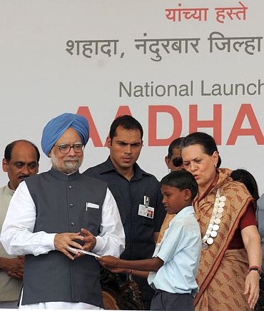 Prime Minister Manmohan Singh launches the Aadhaar Number under Unique Identification Authority of India, at Tembhali village, Nandurbar, Maharashtra on September 29 alongwith Congress President Sonia Gandhi