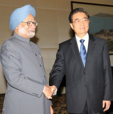 Prime Minister Manmohan Singh with Chinese President Hu Jintao, after a bilateral meeting on the sidelines of the BRICS Summit at Sanya, China