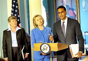 Richard Verma, right, with then US secretary of State Hillary Clinton, centre.