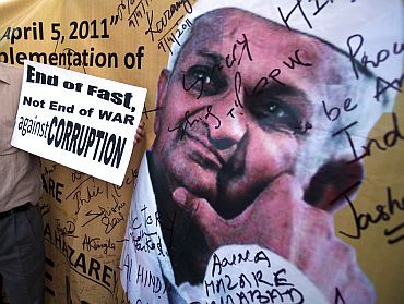 A supporter of social activist Anna Hazare holds a placard during a campaign against corruption, in Chandigarh