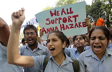 Supporters of social activist Hazare shout slogans during a campaign against corruption in New Delhi