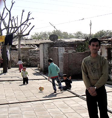 Vinod Dhar outside his present accommodation in the Jammu refugee camp
