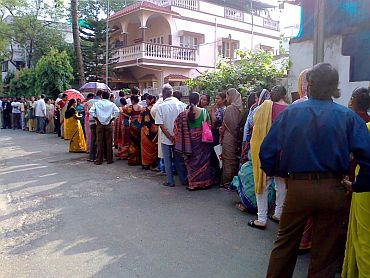 People turn out in heavy numbers in front of a polling booth at Jadavpur in Kolkata on Wednesday morning