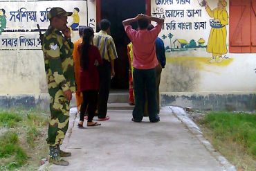 A CRPF jawan guards a polling booth in Kolkata's Jadavpur constituency on Wednesday morning