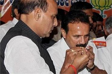 Senior BJP leader Rajnath Singh congratulates Gowda