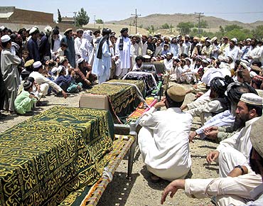 Family members mourn during a mass funeral of civilians killed in US drone strikes in Miranshah, Pakistan